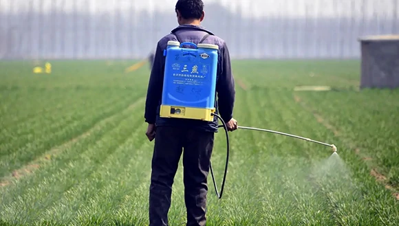 Spraying sodium chlorite solution in an agricultural field